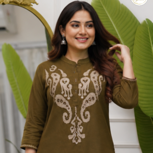 Woman wearing an olive brown embroidered co-ord set with straight pants featuring elegant ethnic embroidery by CholaGhar.